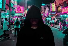 hacker threat in dark hoodie
