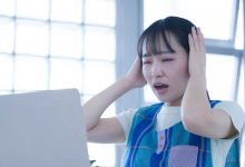 Japan woman frustrated upset mistake error laptop office