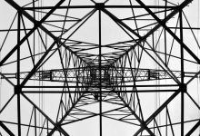 infrastructure electrical tower from below