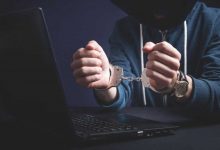 hacker handcuffs laptop cybercrime cyber crime arrested