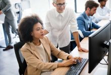 Group of business people working together, brainstorming in office