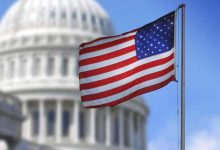 US flag in front of government state capital