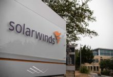 A photograph of a sign with SolarWinds' logo out the front of its headquarters in Austin, Texas.