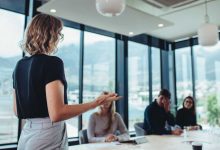 Businesswoman making a presentation to her colleagues in office. Female entrepreneur making a presentation at work.