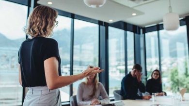 Businesswoman making a presentation to her colleagues in office. Female entrepreneur making a presentation at work.